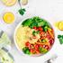 Baked vegetables with hummus bowl. Salad with baked potato, zucchini, broccoli and hummus.
