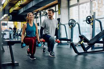 Happy,Athletic,Couple,Having,Weight,Training,In,Lunge,Position,At