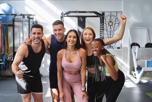 Multicultural,Fitness,Group,Posing,And,Smiling,Looking,At,The,Camera