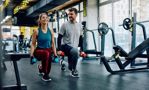 Happy,Athletic,Couple,Having,Weight,Training,In,Lunge,Position,At