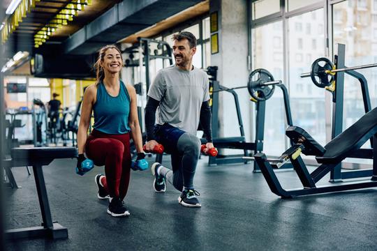 Happy,Athletic,Couple,Having,Weight,Training,In,Lunge,Position,At